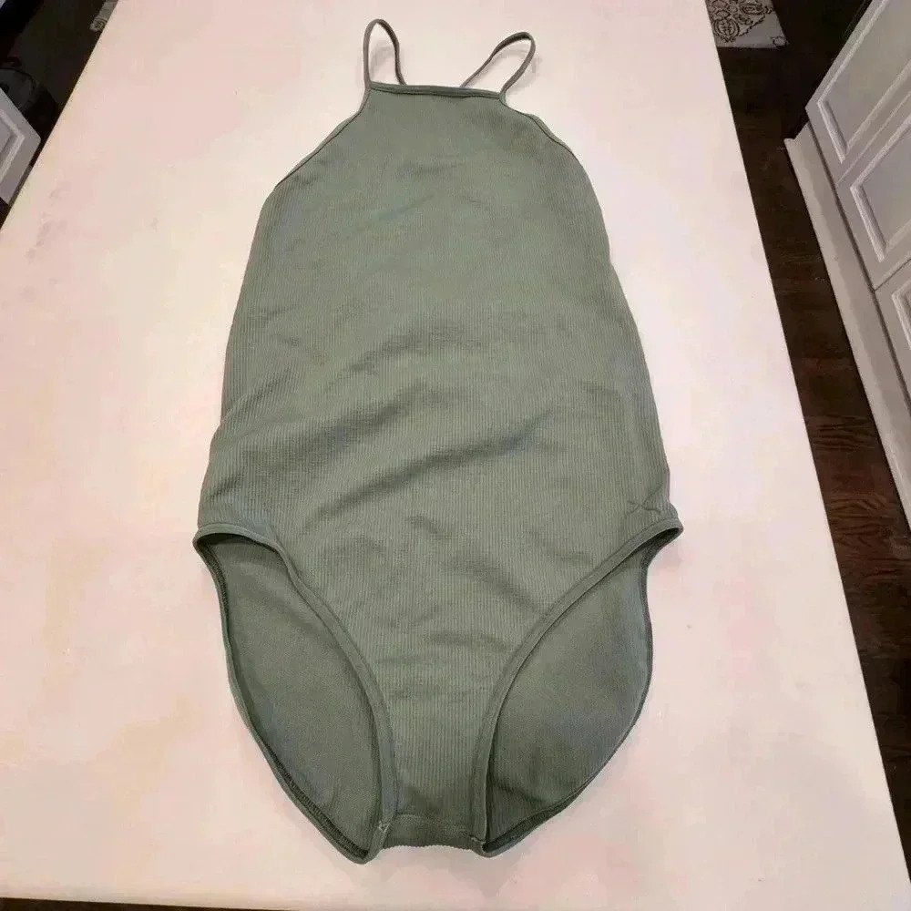 Capezio sage green ribbed body suit. Criss cross back with tie. NEW size M/L